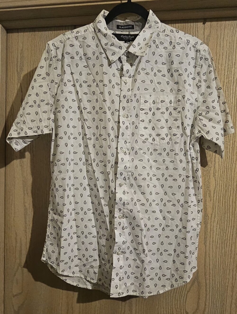 Classic White Short-Sleeve Button-Down with Small Black Paisley Leaf Print